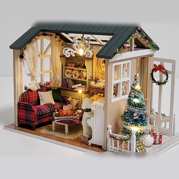 Finished Christmas Cabin with warm LED lights on